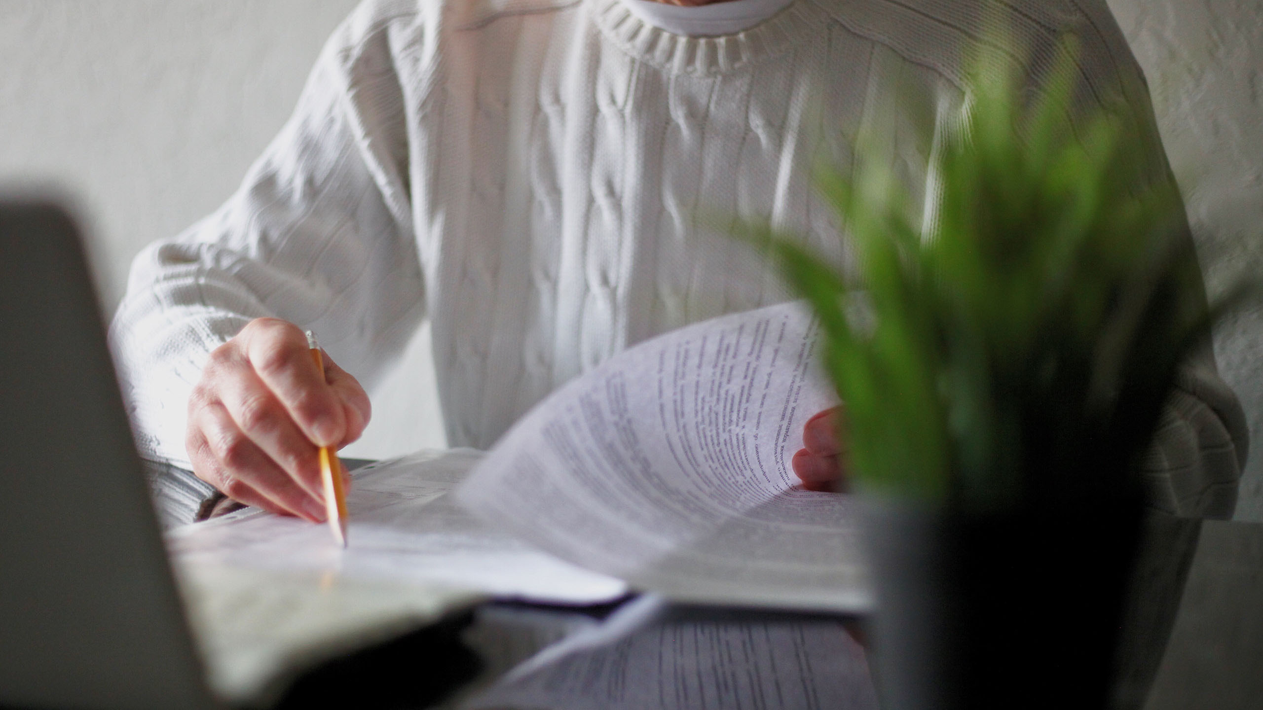 man reading a document with a pen